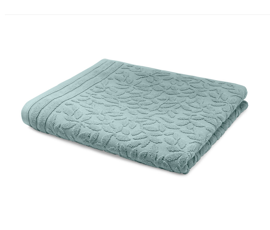 Zusammengelegtes mintfarbenes Jacquard-Badetuch.