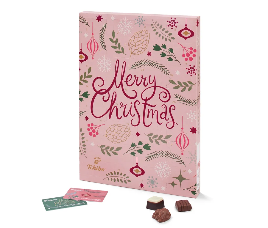 Ein rosa Tchibo-Adventskalender mit Weihnachtsmotiv und Pralinen.