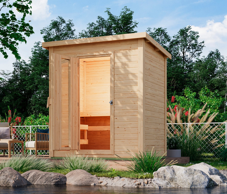 Karibu Sauna »Elli 1« mit offener Tür steht draußen am Wasser.