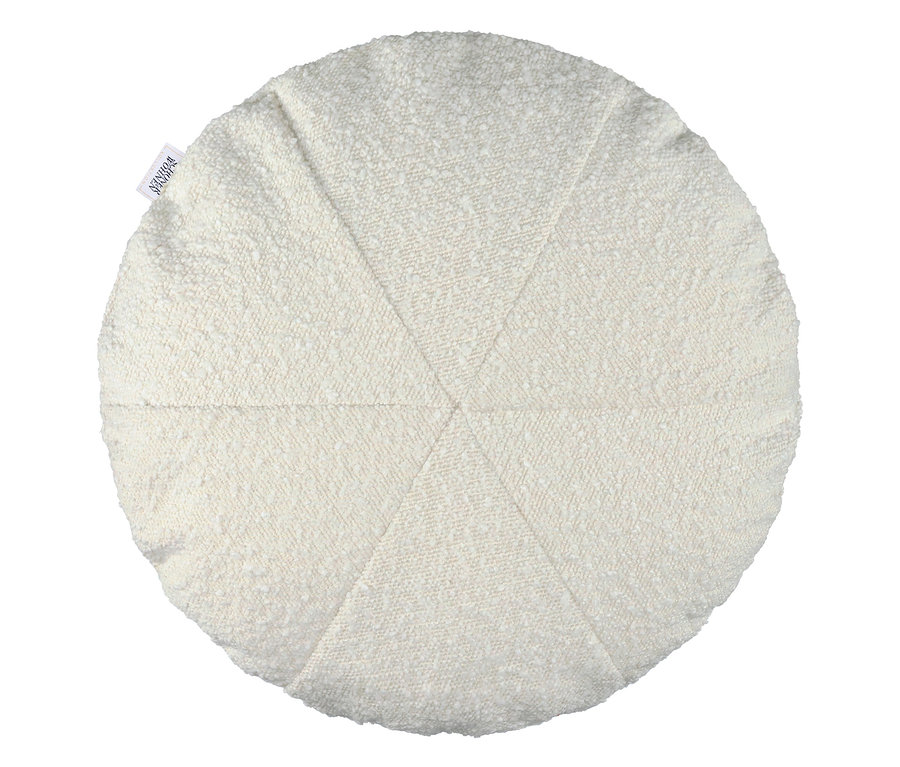 Nahaufnahme eines runden, strukturierten, weißen Kissens.