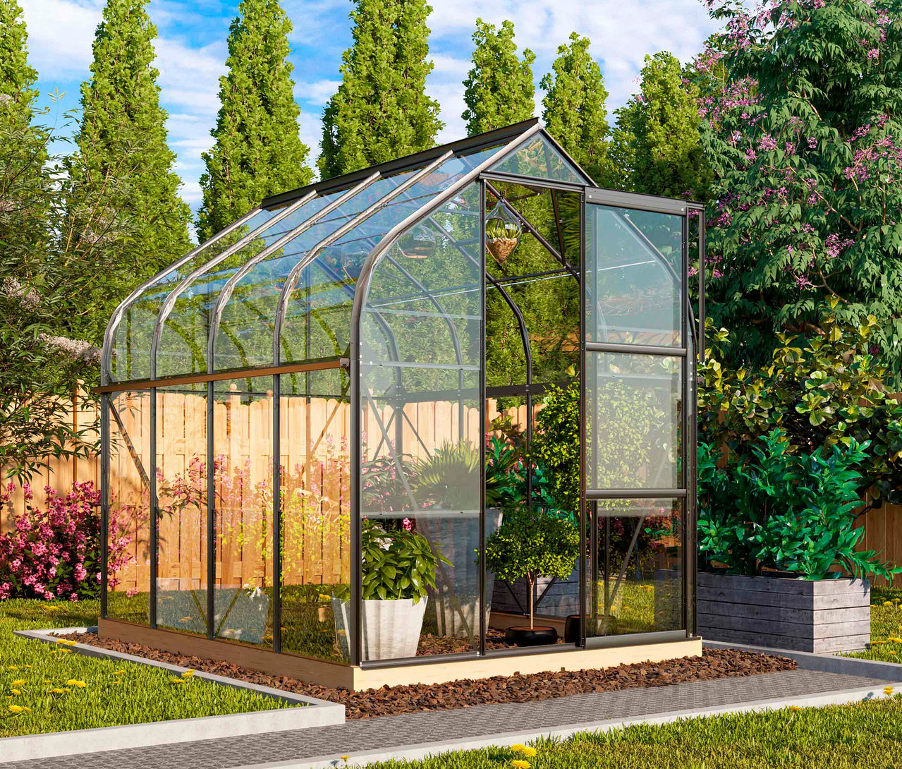 Vitavia Gewächshaus Orion ESG 5 m² inkl. Rahmenfundament mit Pflanzen im Garten.