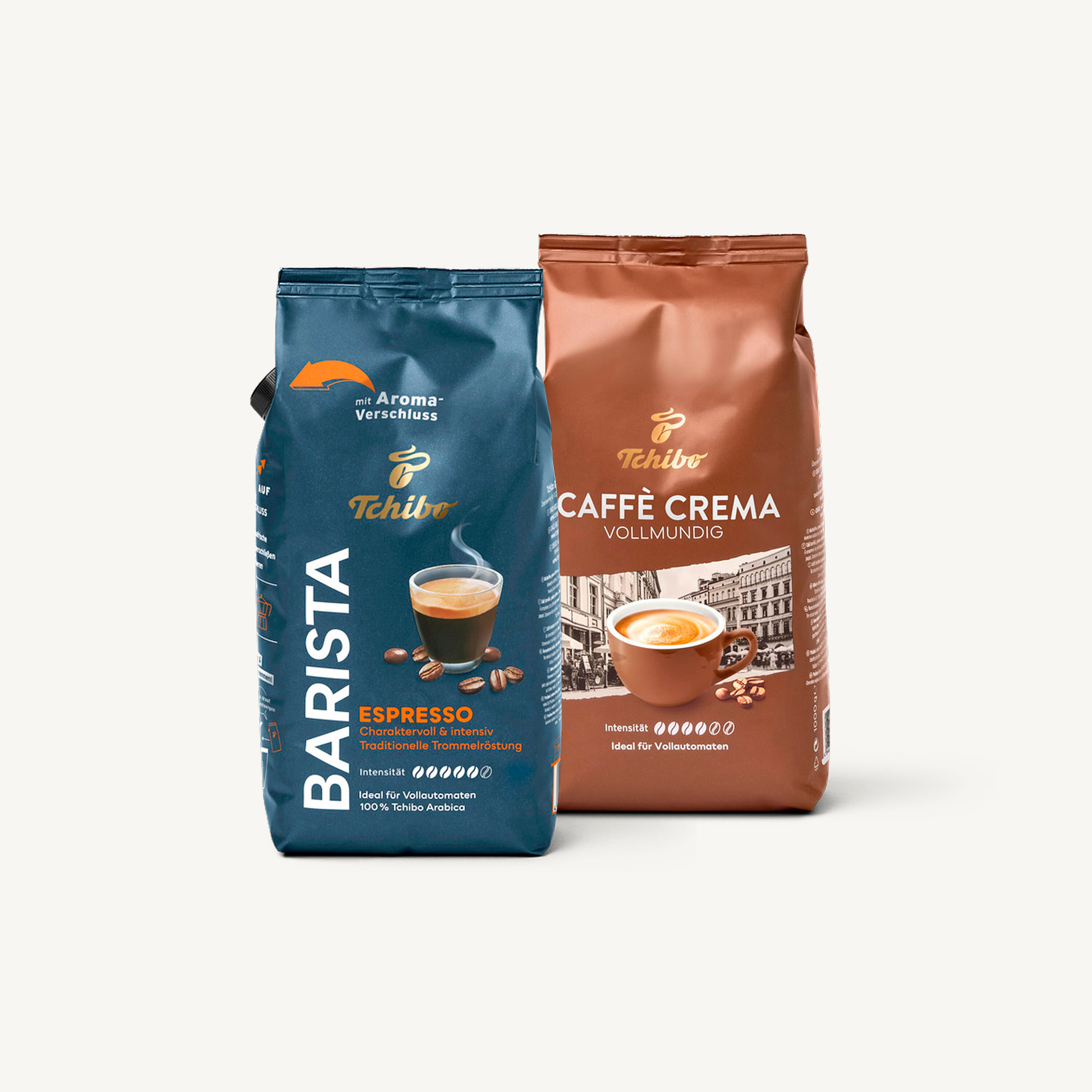Zwei Packungen Tchibo Kaffee: Barista Espresso in blauer Packung und Caffè Crema Vollmundig in brauner Packung.