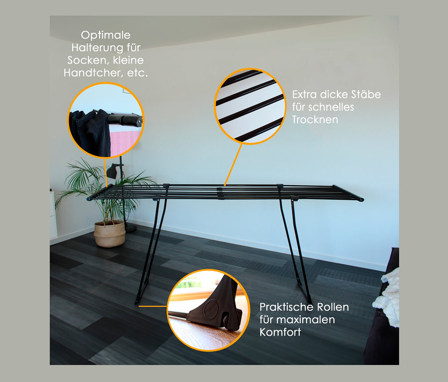 Schwarzer Teleskop-Wäscheständer im Innenraum.