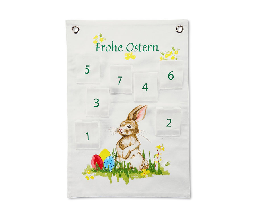 Weißer Osterkalender mit Taschen und einem Bild von einem Hasen und Ostereiern.