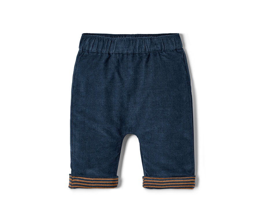 Eine marineblaue Wende-Schlupfhose aus Cord mit braun gestreiften Bündchen.