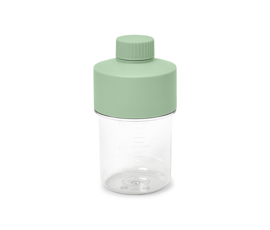 Transparente Dressingflasche mit mintgrünem Deckel.