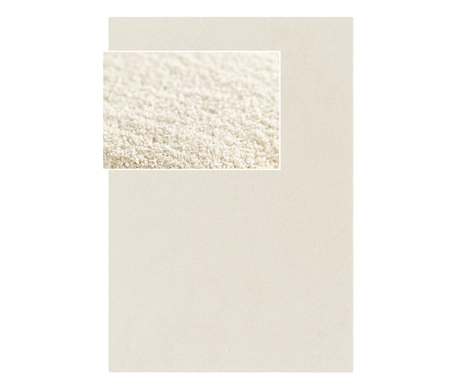 Nahaufnahme eines cremeweißen Teppichs »Mellow«.