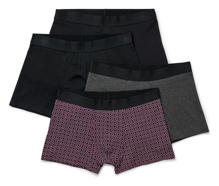 Vier Slipboxer in Schwarz, Grau und mit Muster.