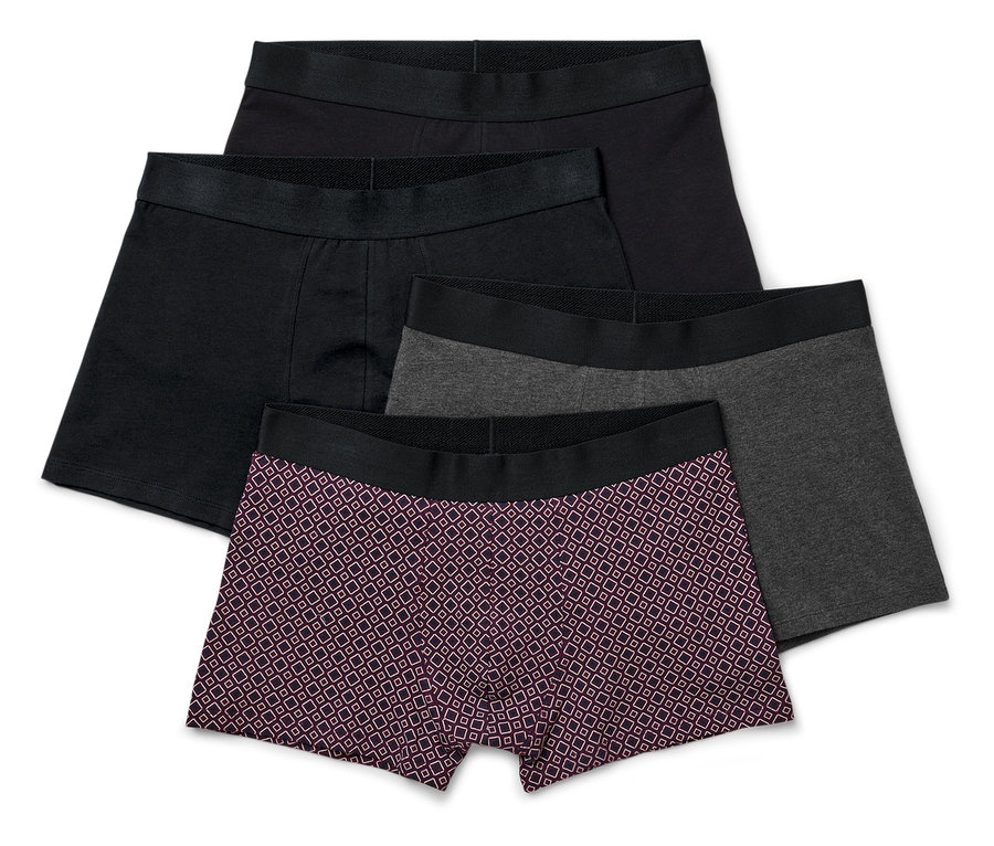 Vier Slipboxer in Schwarz, Grau und mit Muster.