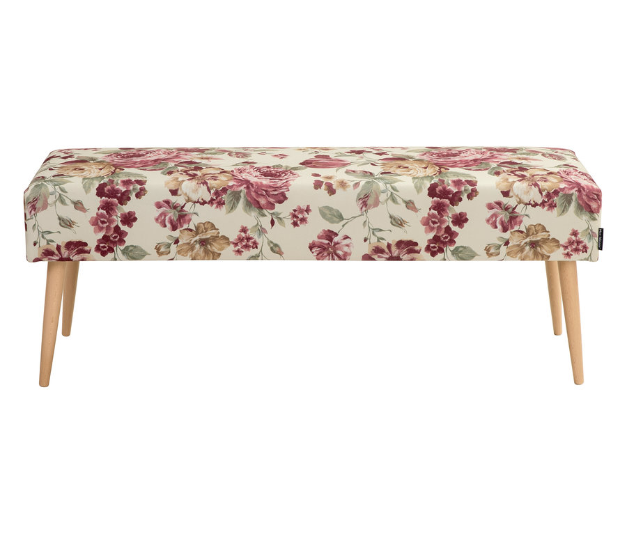 Eine rechteckige Bank mit einem Blumenmusterbezug und vier Holzbeinen.