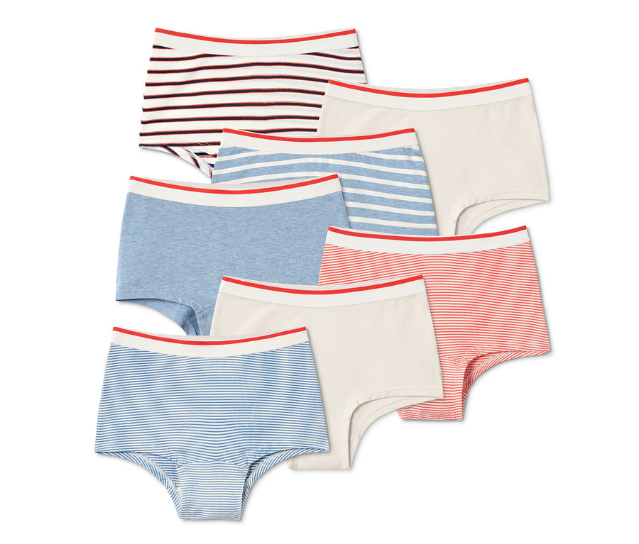 Sieben Mädchen-Pantys in verschiedenen Farben und Mustern mit rotem Bund.