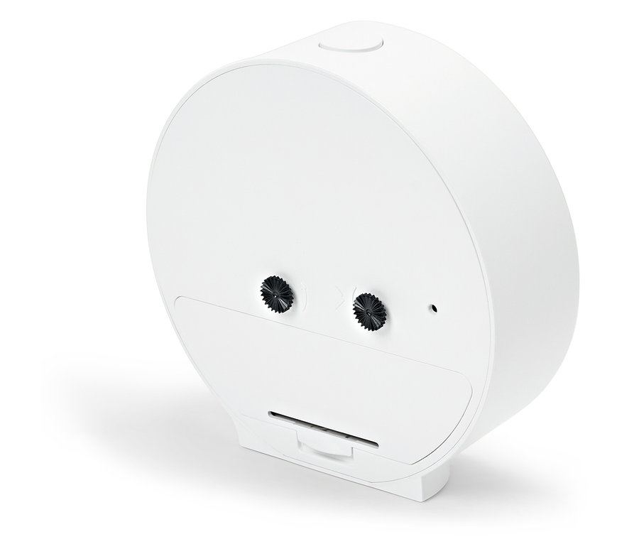 Detailansicht eines weißen, runden Weckers mit einem Knopf oben und zwei Knöpfen auf der Rückseite.