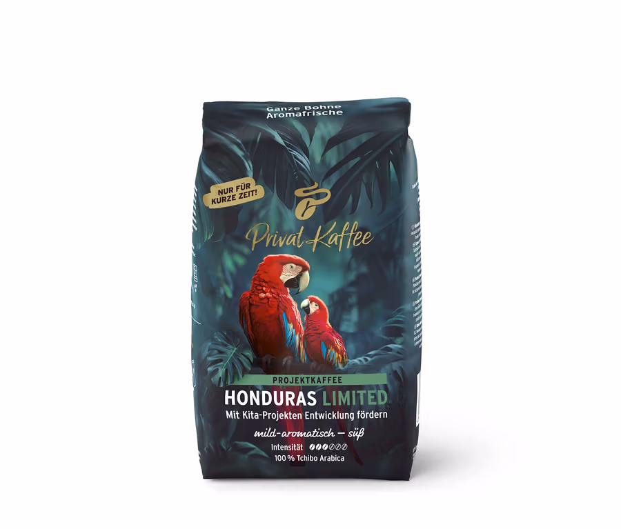 Dunkelgrüne Kaffeepackung Privat Kaffee Limited Edition Honduras mit tropischem Design und zwei roten Aras.