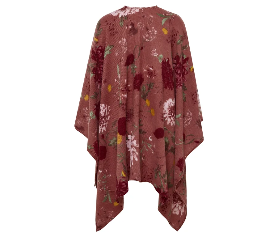 Detailaufnahme eines braunen Ponchos mit Blumenmuster.