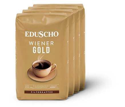Vier Packungen Eduscho Wiener Gold 4x 500g ganze Bohne Kaffee auf weißem Hintergrund.