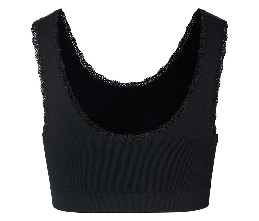 Schwarzes, geripptes Bustier mit Spitzenbesatz am Ausschnitt und an den Armausschnitten.