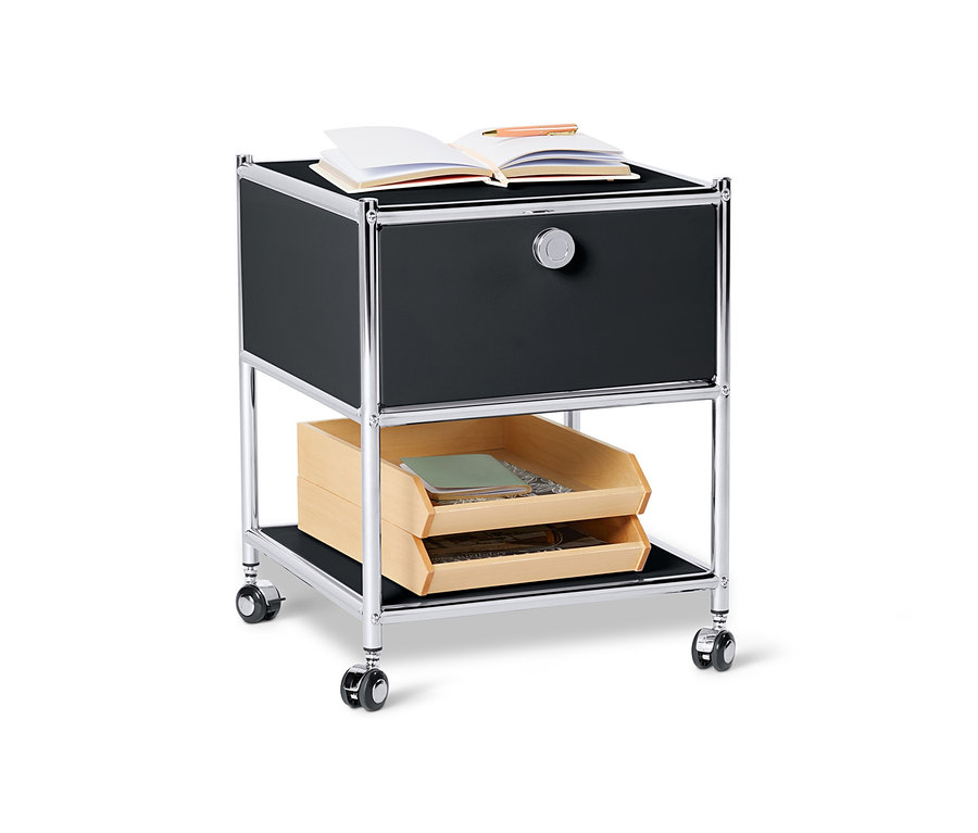 Schwarzer Beistelltisch Metall »CN3« mit Schublade und offenem Buch oben drauf.