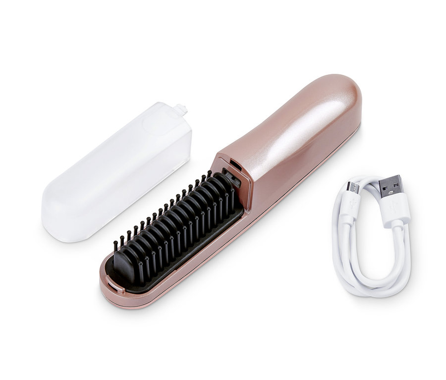 Eine kabellose Glättbürste mit schwarzen Borsten, einem Ladekabel und einer durchsichtigen Abdeckung.
