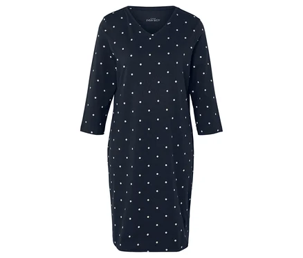 Blaues Kleid mit weißen Punkten und 3/4-Ärmeln.