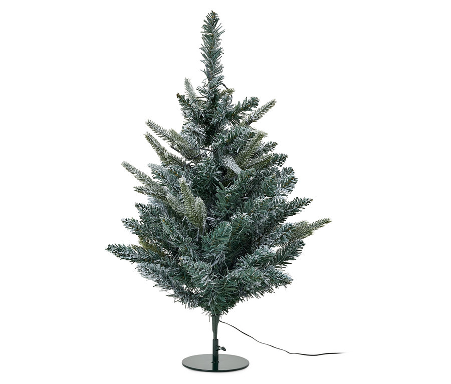 Grüner künstlicher Weihnachtsbaum mit schneebedeckten Ästen auf einem grünen Metallständer.
