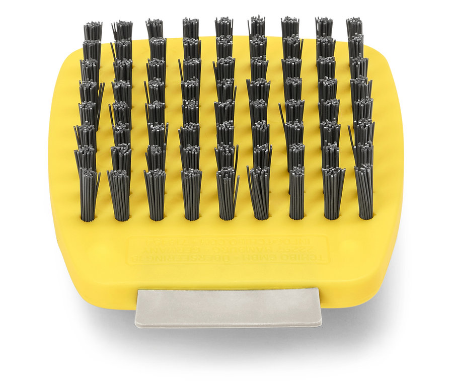 Gelbe Bürste mit vielen kleinen schwarzen Borsten.