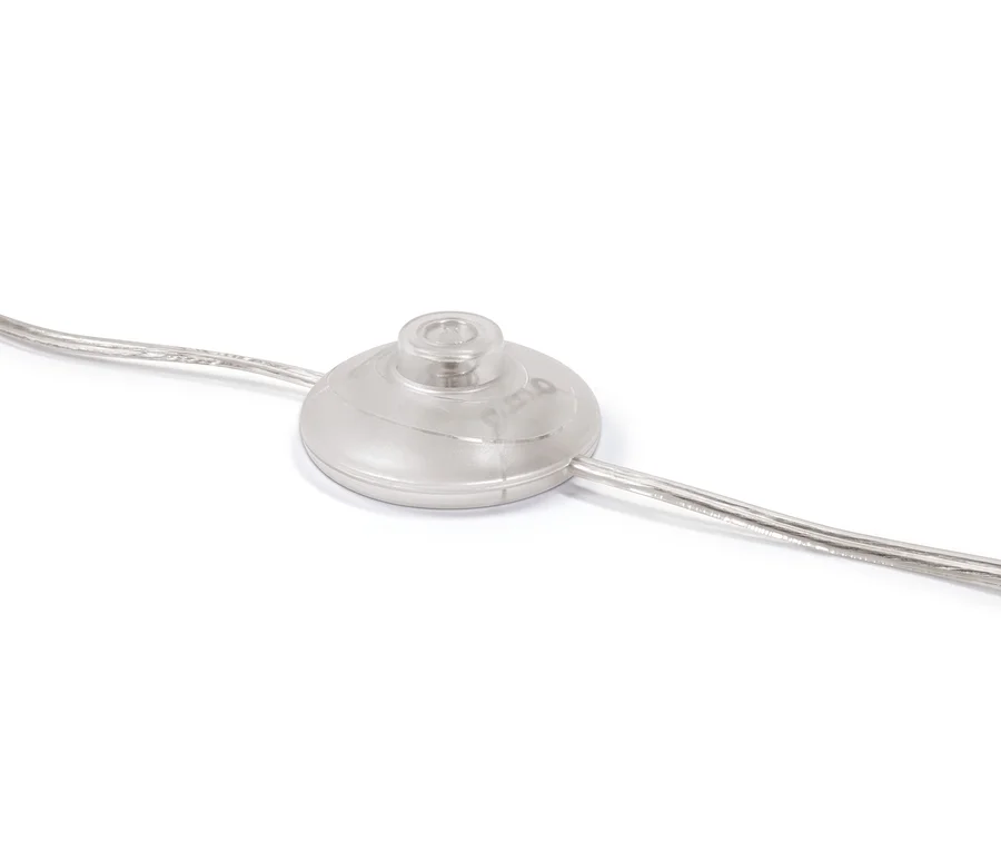 Detailaufnahme des Fußschalters der Stehleuchte »Glaskugel«.