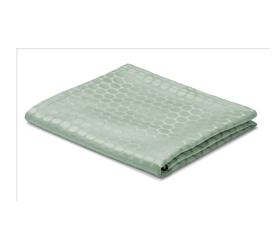 Eine gefaltete Jacquard-Tischdecke mit einem Kreismuster.