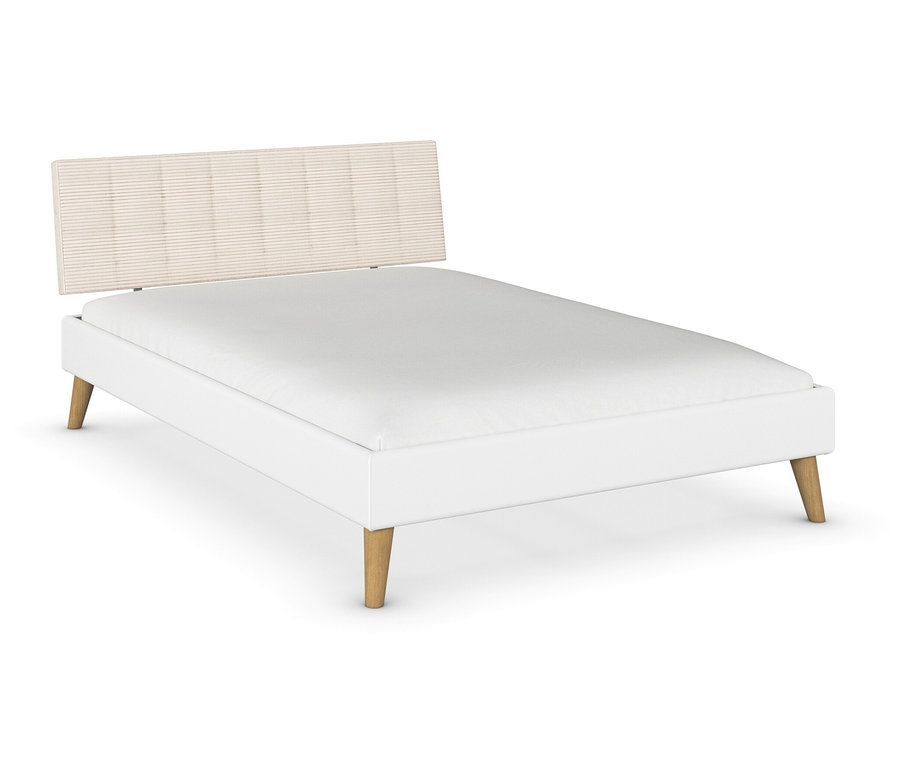 Weißes Bett mit beigem Kopfteil.