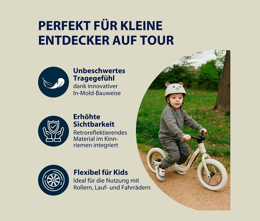 Ein Junge auf einem Laufrad trägt einen HUDORA Kinderhelm, Beary, 48–52 cm.