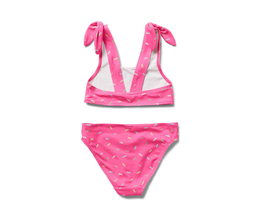 Ein rosafarbener Kinder-Bikini mit bunten Streuseln.