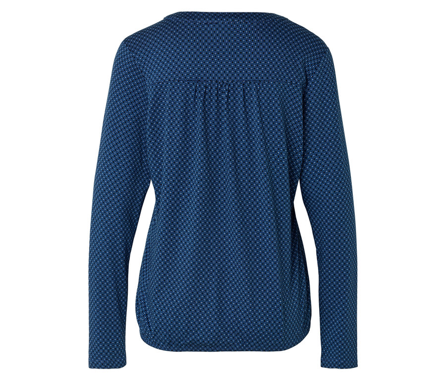Rückansicht einer dunkelblauen, langärmligen Bluse mit einem weißen Punktmuster.
