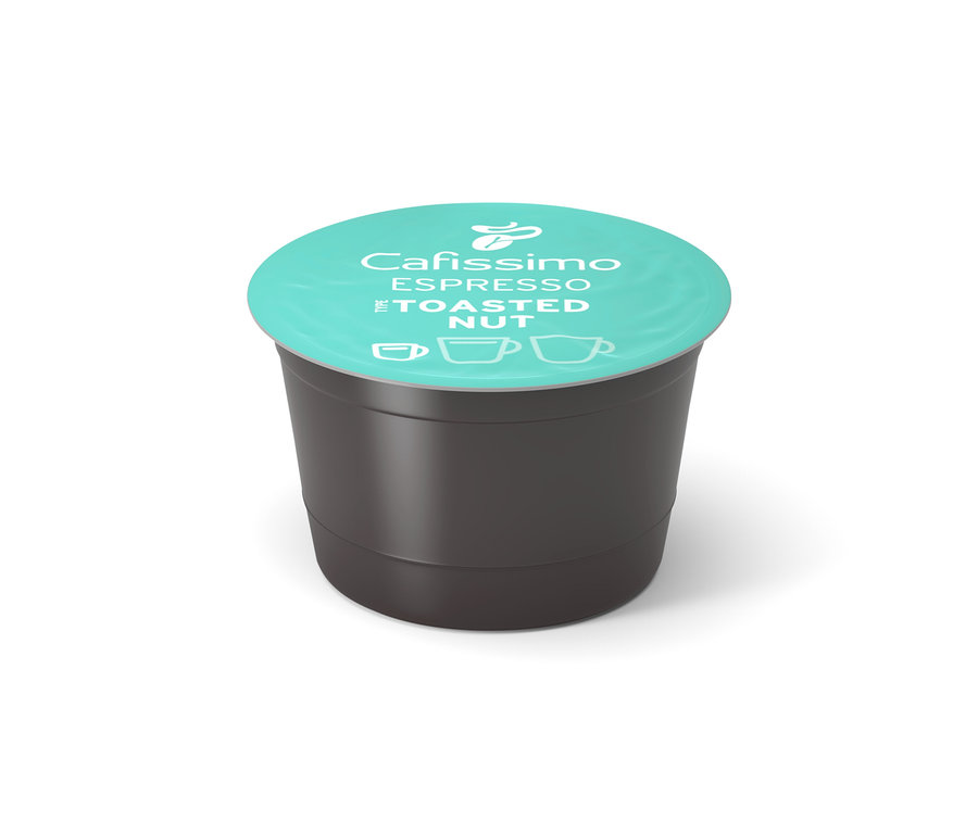 Eine Cafissimo Flavoured Espresso - Toasted Nut - Kapsel liegt auf einem weißen Untergrund.