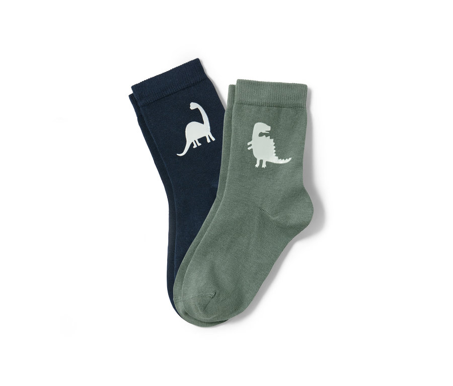 Zwei Paar Socken, Glow in the Dark, mit Dinosaurier Motiven.