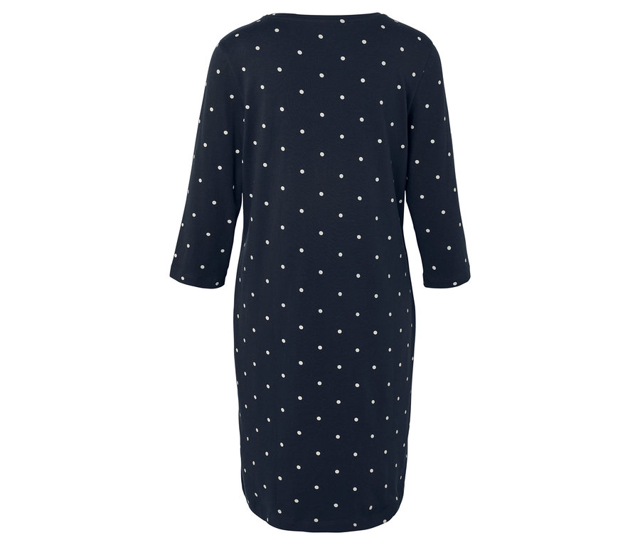 Rückansicht eines marineblauen Kleides mit weißen Tupfen und Dreiviertelärmeln.