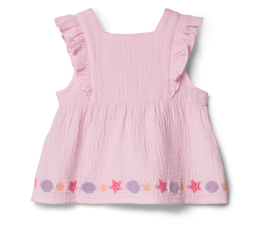 Rosa, ärmelloses Kleid mit Rüschen und Seestern- und Muschelstickerei am Saum.