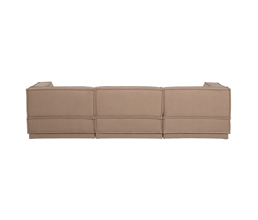 Rückansicht eines modularen, beigefarbenen Sofas mit drei Segmenten und sichtbaren Nähten.
