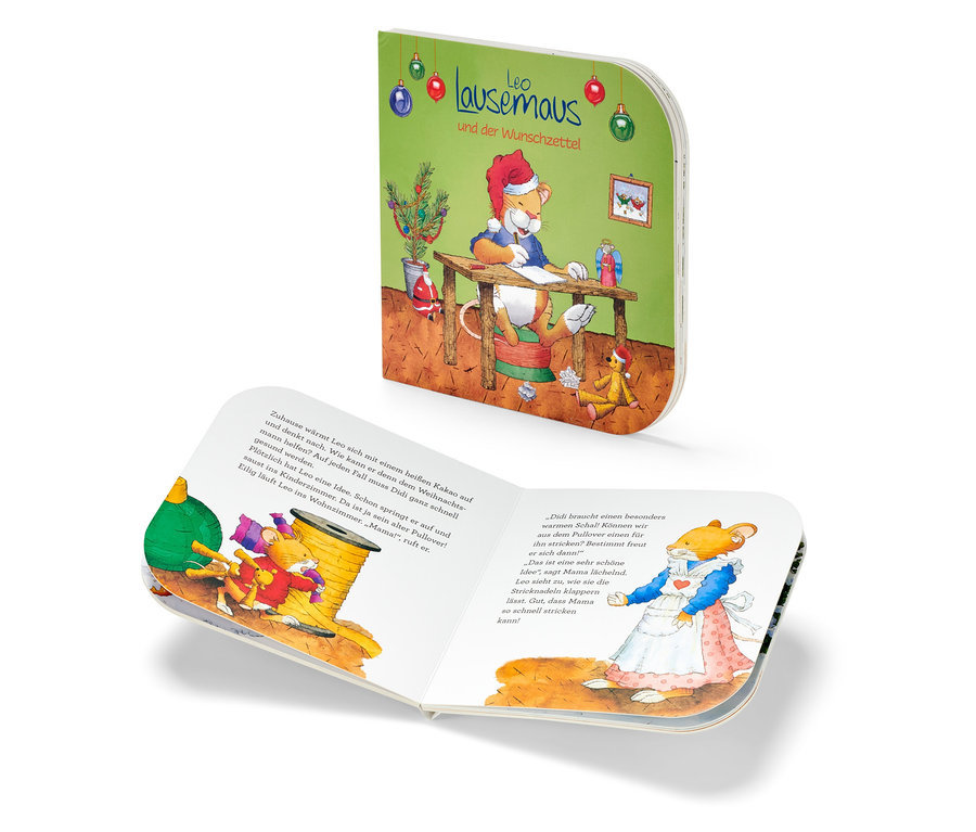 Geöffnetes Kinderbuch "Leo lausemaus und der Wunschzettel" mit Illustration eines Löwen, der einen Brief schreibt.