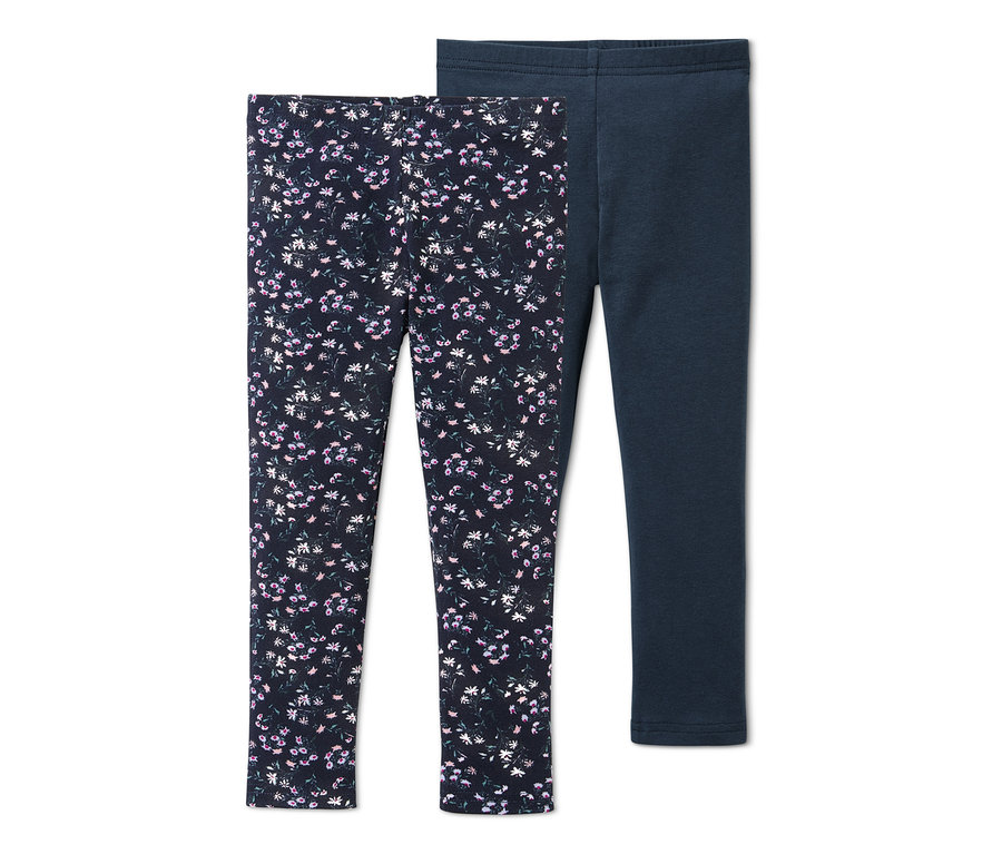 Zwei Leggings, eine dunkelblau mit Blumenmuster, die andere dunkelblau.