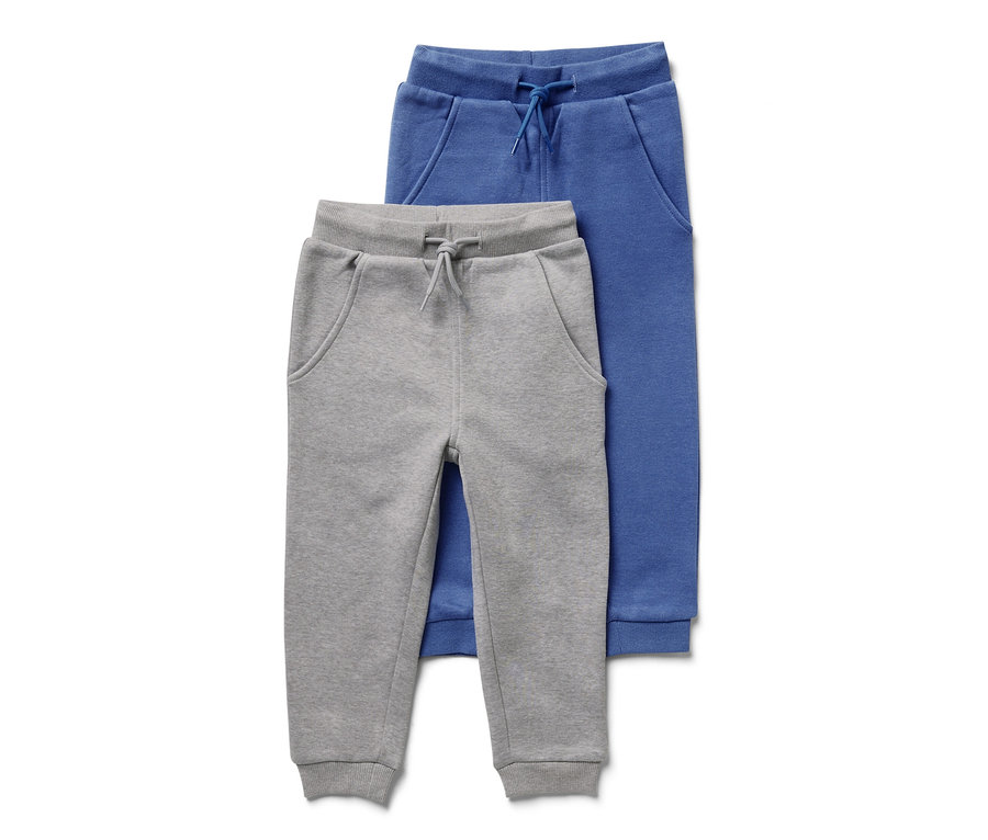 Zwei Kinder-Sweathosen, eine graue und eine blaue.
