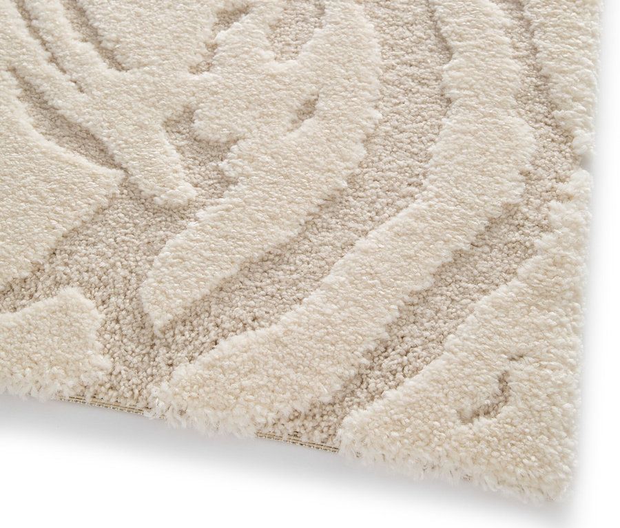 Detailaufnahme eines cremefarbenen Teppichs »Cosmo «Waves.