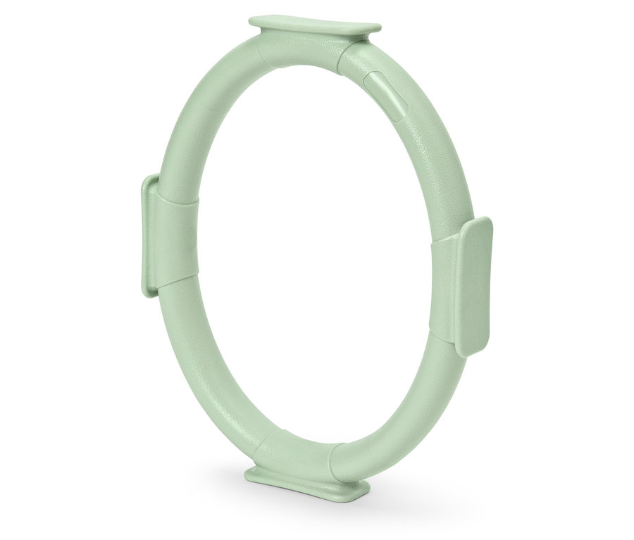 Ein hellgrüner Pilates-Ring auf weißem Hintergrund.