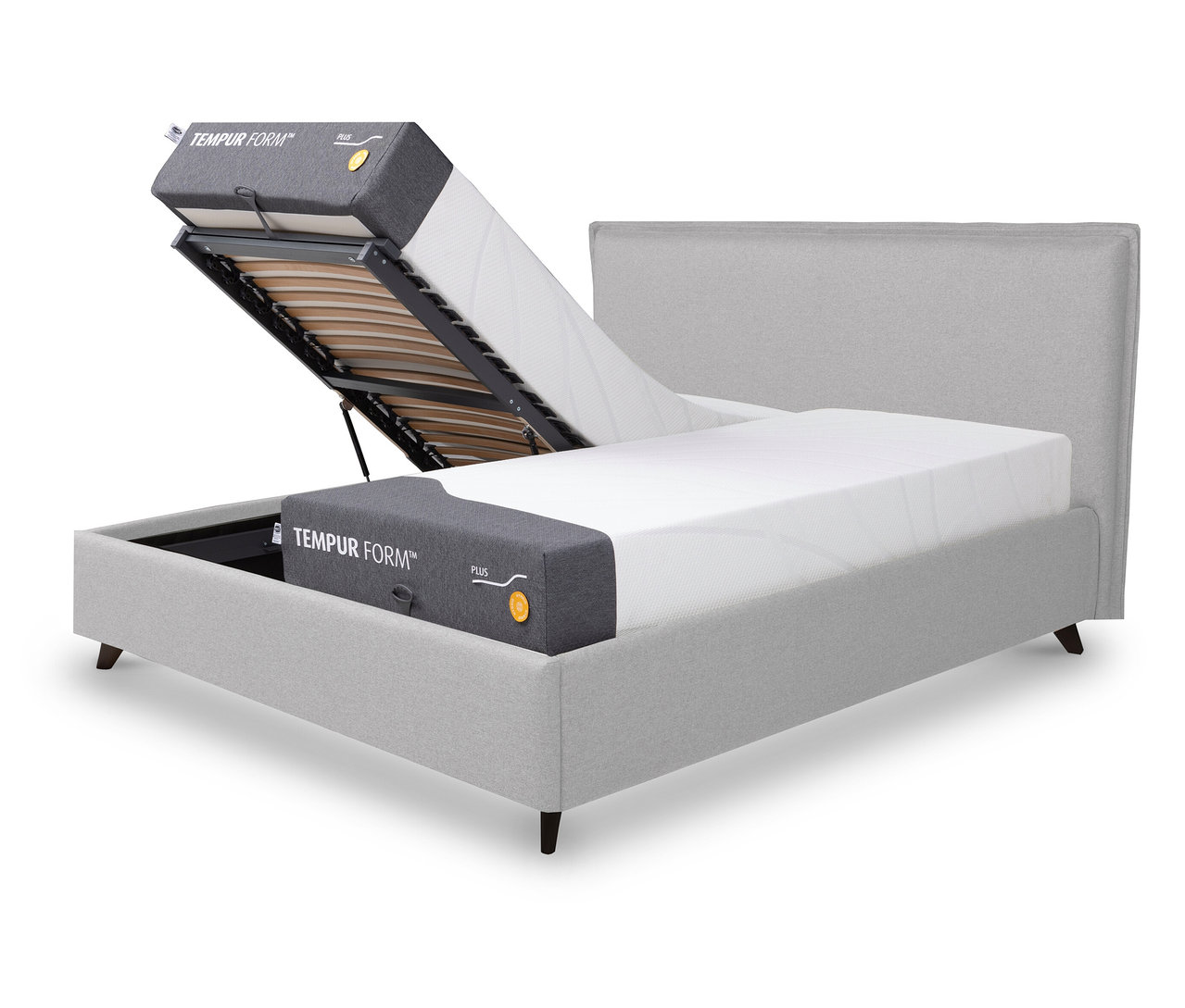 Graues TEMPUR FORM™ Bett PLAIN mit teilweise angehobenem Lattenrost und Matratze.