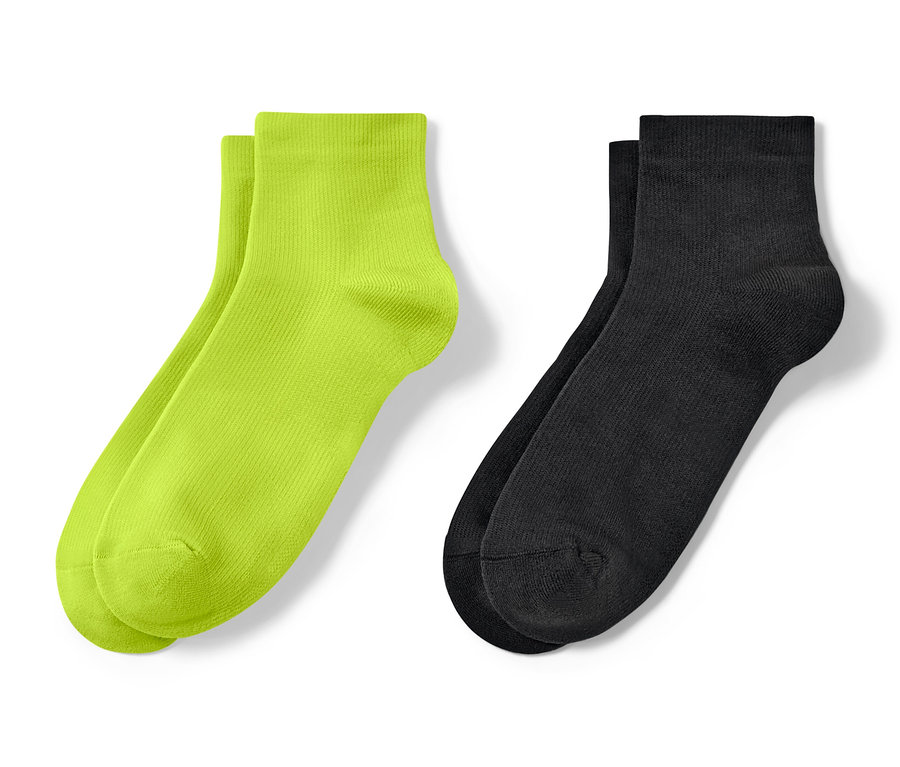 Zwei Paar kurze Sportsocken: Neongrün und schwarz.