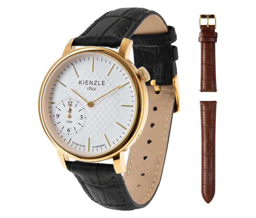 Nahaufnahme einer goldenen Kienzle-Uhr mit schwarzem Lederarmband und einem zusätzlichen braunen Armband.