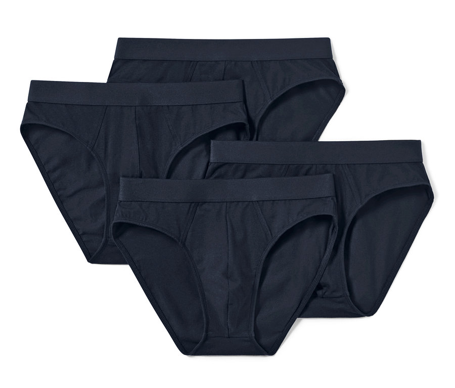 Vier dunkelblaue Slips liegen auf einem weißen Hintergrund.