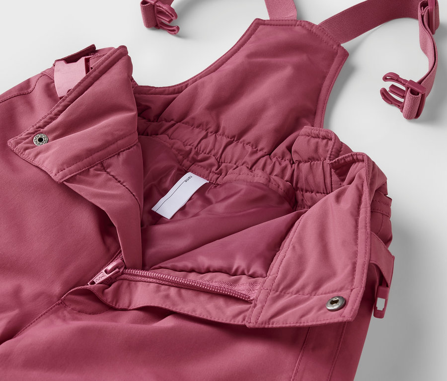Nahaufnahme einer geöffneten, rosafarbenen 2-teiligen Kinder-Schneekombi.