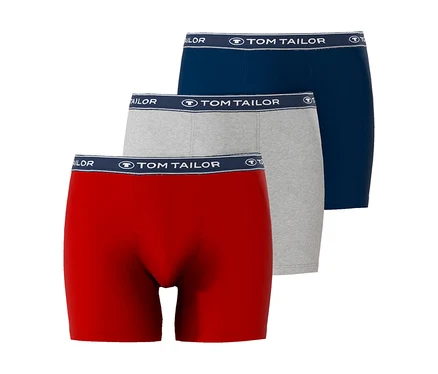 Drei Tom Tailor Boxershorts in Rot, Grau und Blau liegen übereinander.