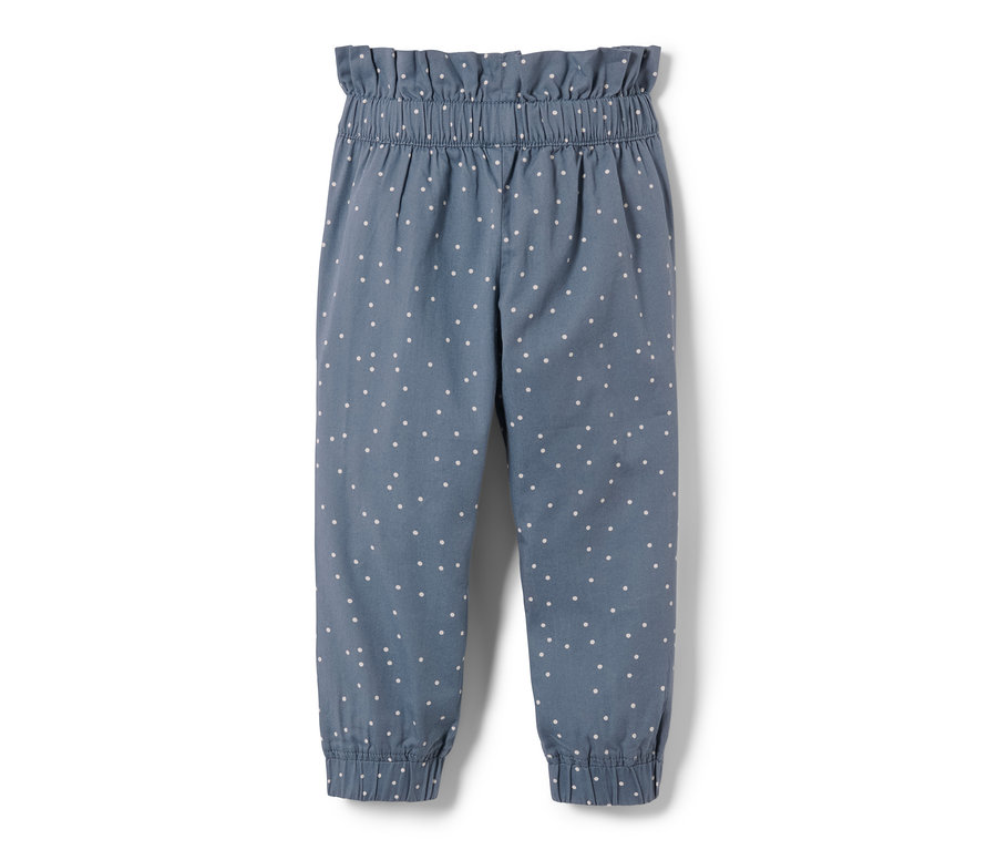 Eine blaue Kleinkinder-Paperbaghose mit weißen Punkten.