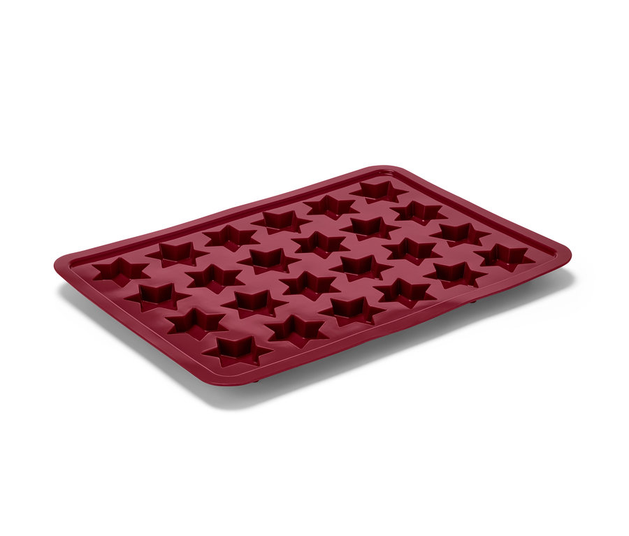 Eine rote Zimtstern Backmatte aus Silikon mit 24 sternförmigen Vertiefungen.