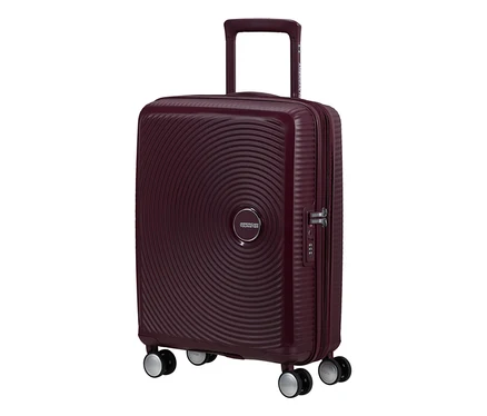 American Tourister Hartschalen-Koffer Soundbox Spinner in Wildkirschrot mit konzentrischen Kreisen und ausziehbarem Griff.
